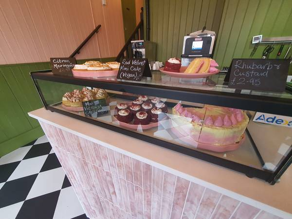 Display counter of cakes and sweet treats at The Pink Olive